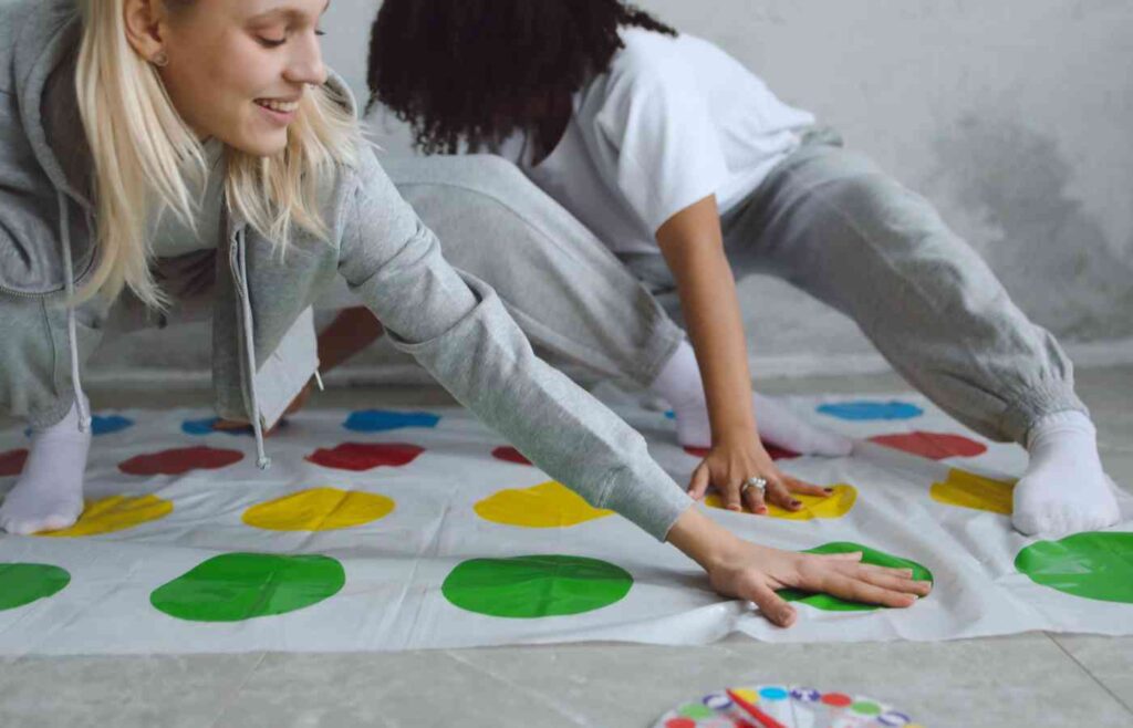 Two people playing Twister.