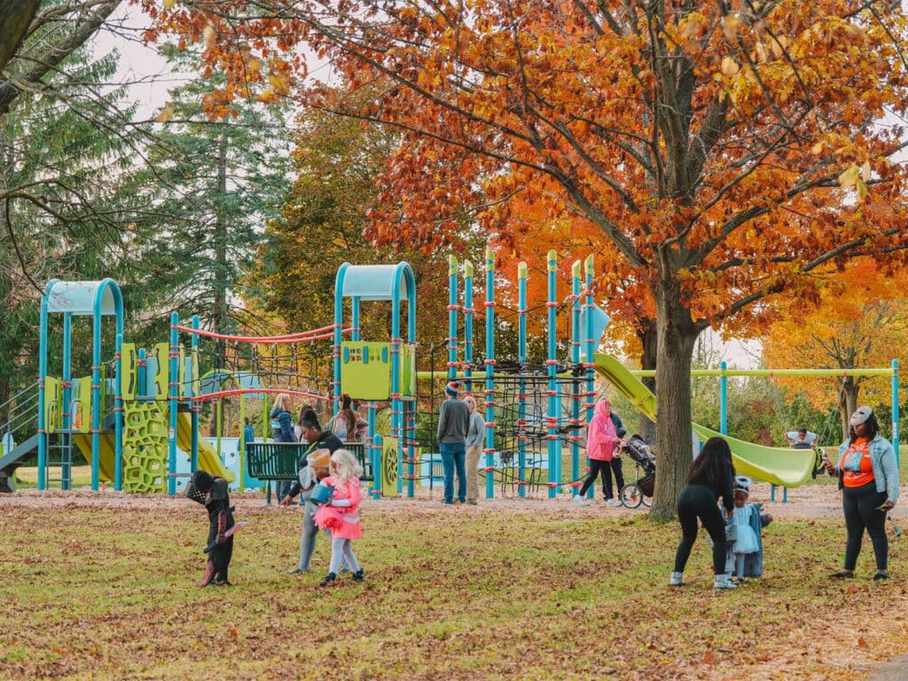 Children play at Popuch Park on an Autumn day in Milwaukee, Wisconsin.
