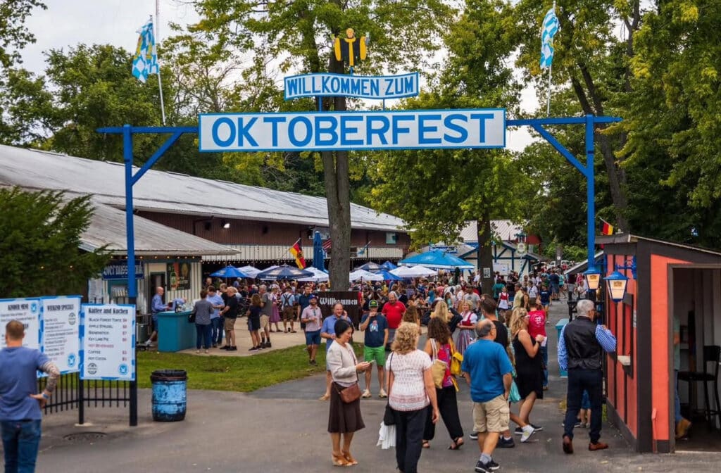 Crowds entering Bavarian Bierhaus Oktoberfest 2025 under Willkommen Zum Oktoberfest sign in Glendale WI