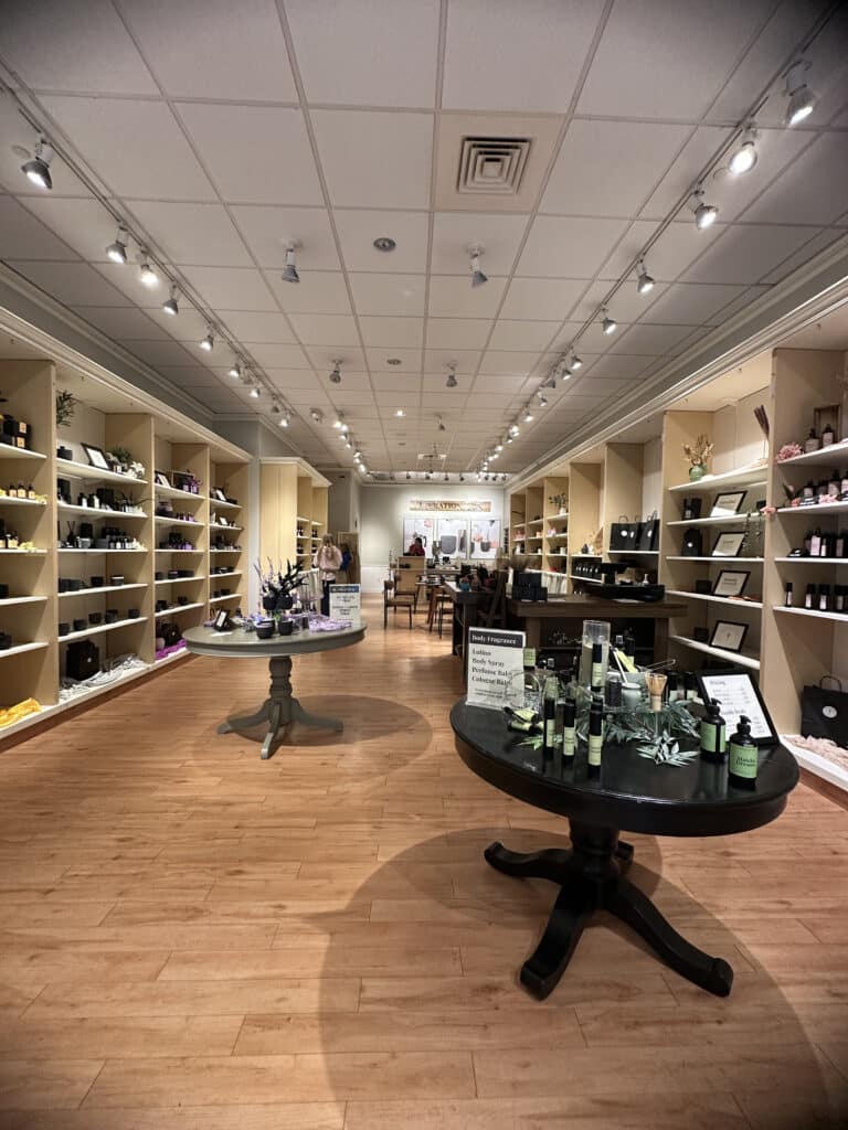 Wide angle view of Operation Wax at Southrideg with tables and shelves lined with candles, lotions and more.