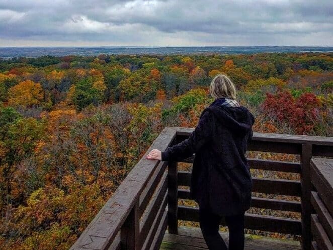 A person enjoying autumn foliage from the Parnell Tower Kettle Moraine State Forest Sheboygan Wisconsin