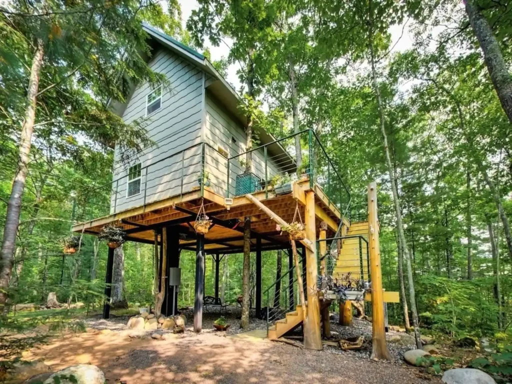 Wooden treehouse surrounded by lush forest in the Apostle Islands, Wisconsin