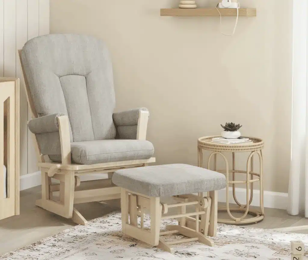 Dutailier Adele glider with padded arm rest and rattan side table with cactus