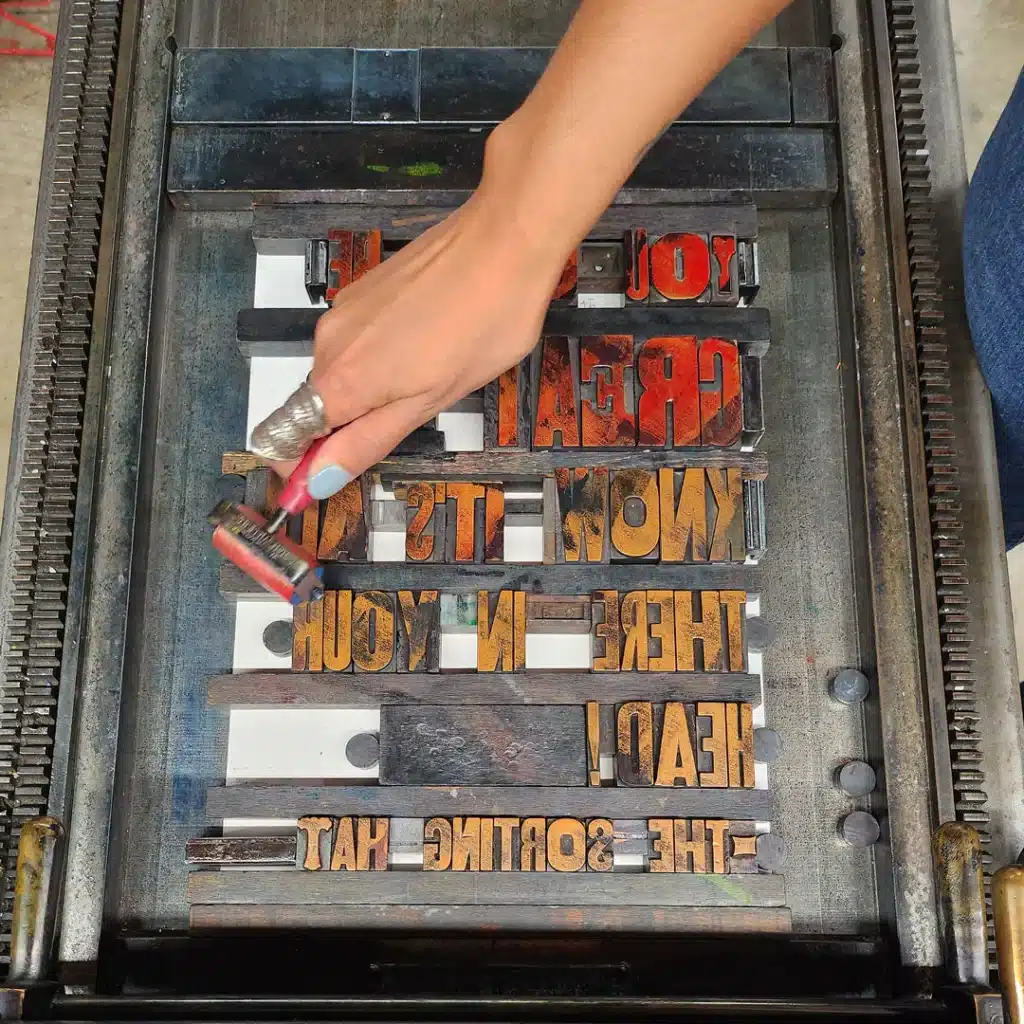 Participants arranging wooden type pieces on a workstation during a letterpress workshop at Bay View Printing Co.