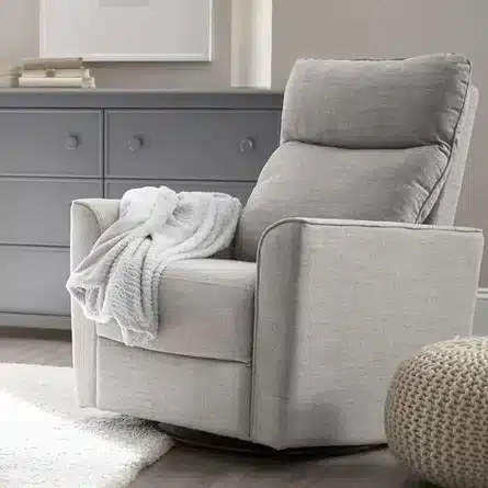 Soho swivel glider from Wayfair with a chest of cabinets and blanket