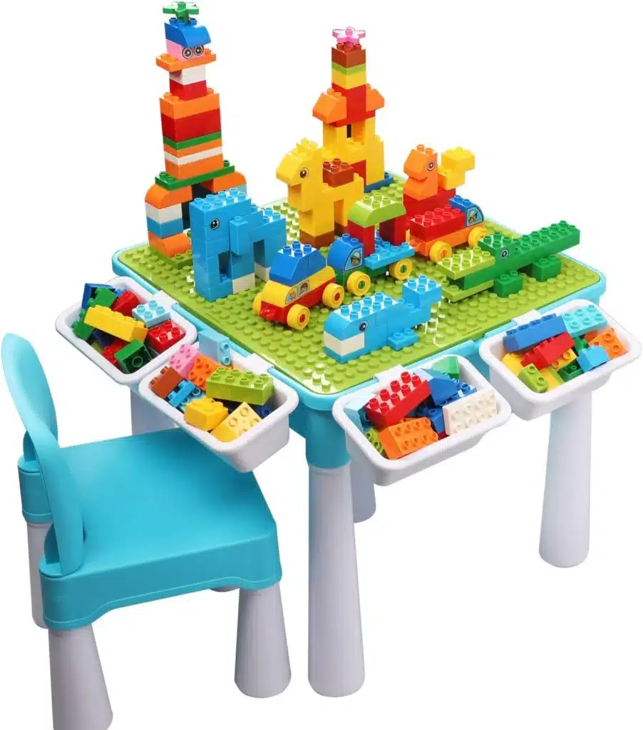 An activity table with LEGO pieces shaped like a whale and cars
