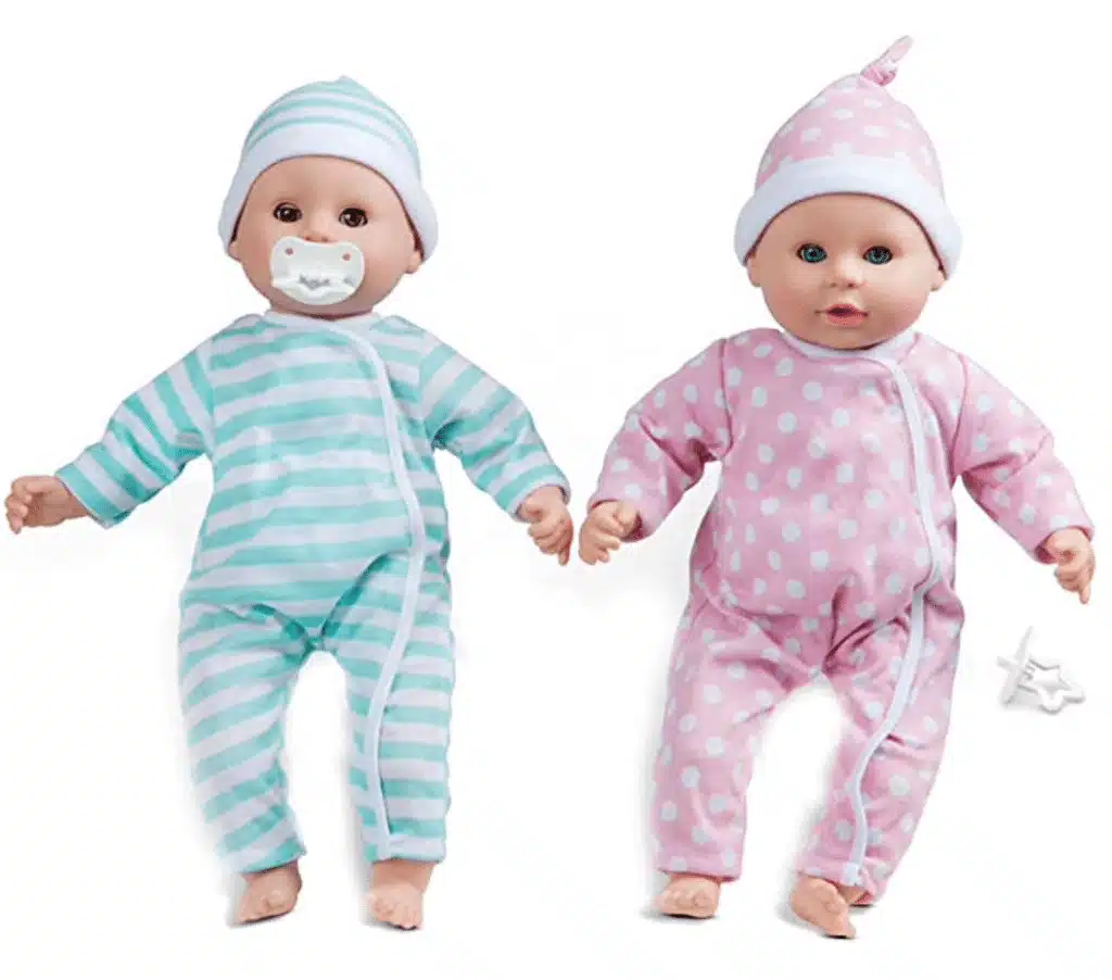 Twin dolls in blue and pink clothes and pacifier