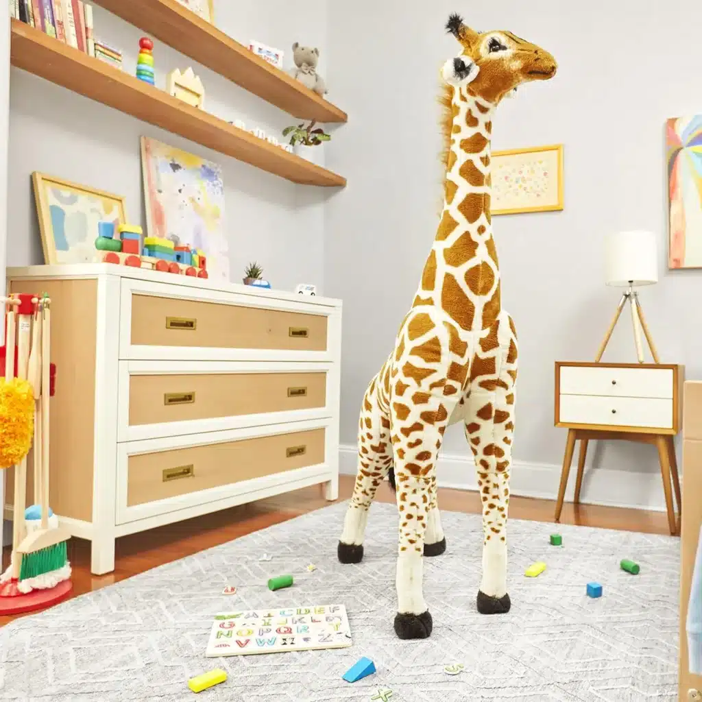 A tall giraffe plushy standing in the middle of the playroom