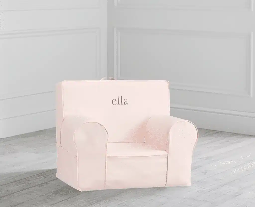 A pink Anywhere Chair with the name Ella embroidered in the middle