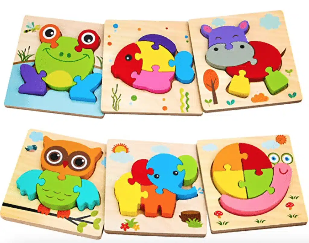 Six wooden animal puzzles designed as an owl, fish, hippo, snail, elephant and frog