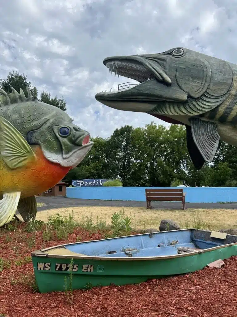 Two giant sculptures of freshwater fishes and sailboat at the Hayward Freshwater Fishing Hall of Fame