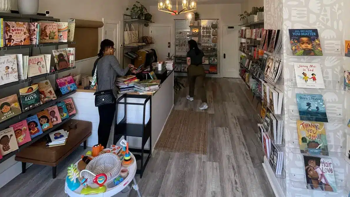 Two women tending a bookstore that focuse on black history