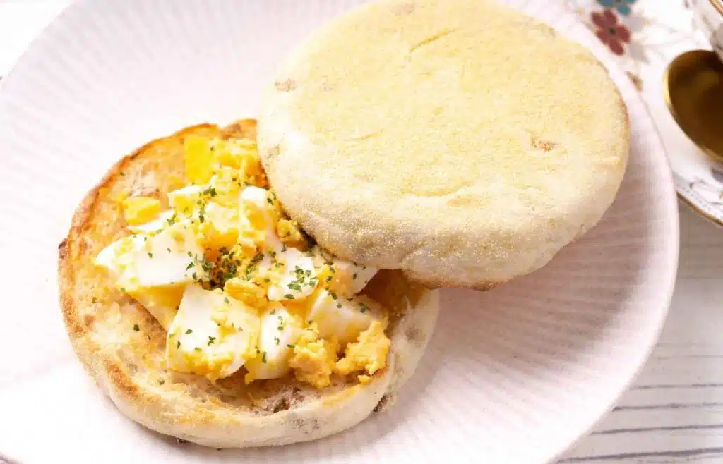 Scrambled egg and herbs on a toasted whole-grain English muffin.