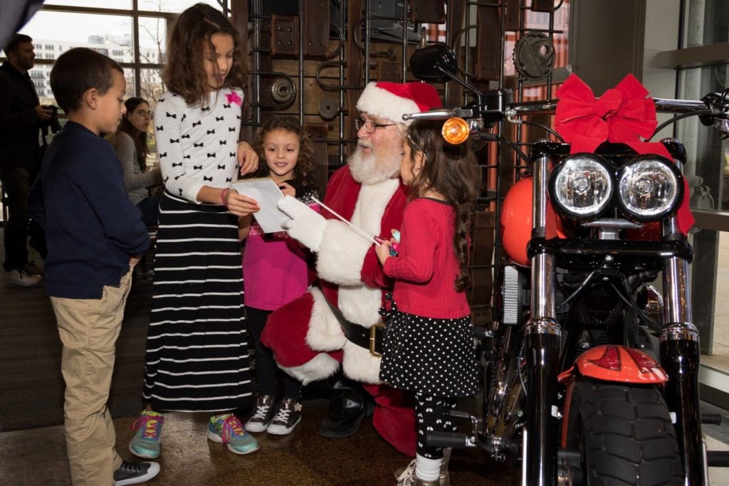 Santa visiting families during brunch at Harley-Davidson Museum in Milwaukee.