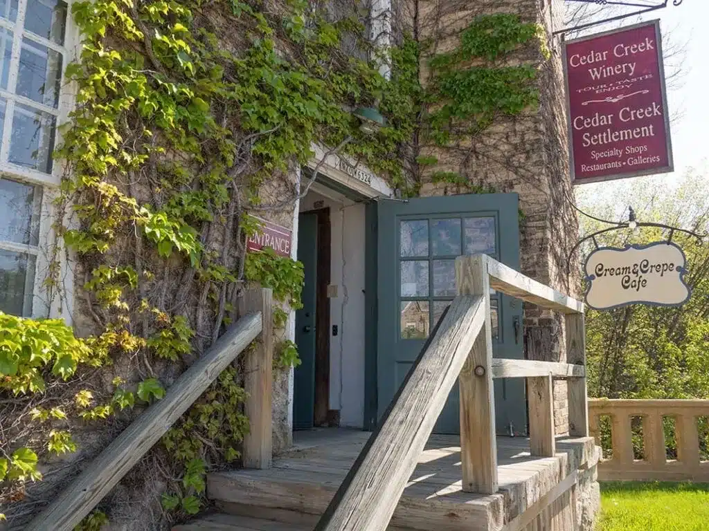 The entrance to Cedar Creek Winery with its vine covered walls and blue door