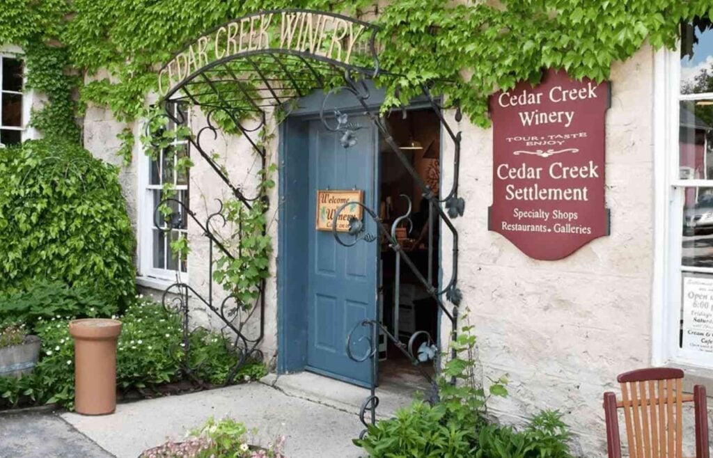 Charming vine-covered entrance of Cedar Creek Winery in historic downtown Cedarburg.