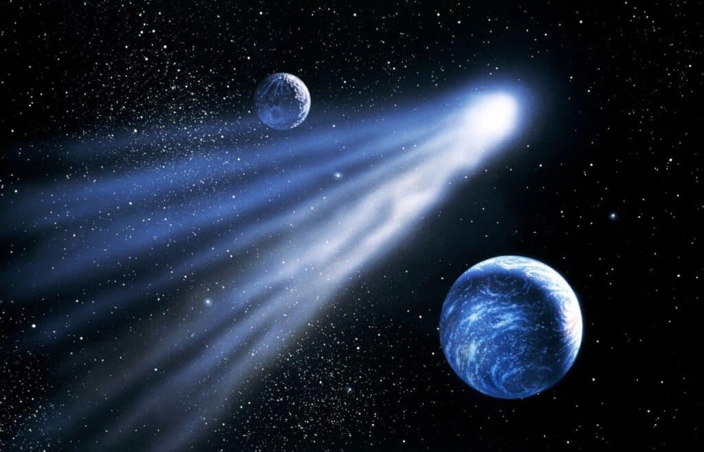 A comet flying past two planets in space