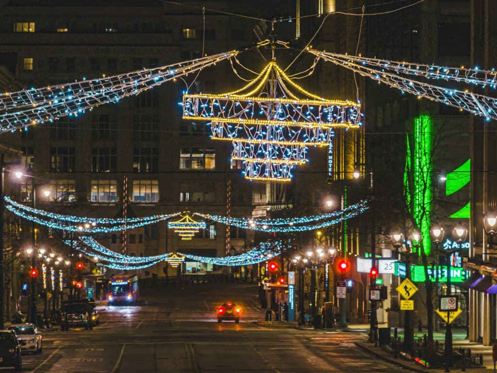 Downtown Milwaukee being decorated with large chandelier lights