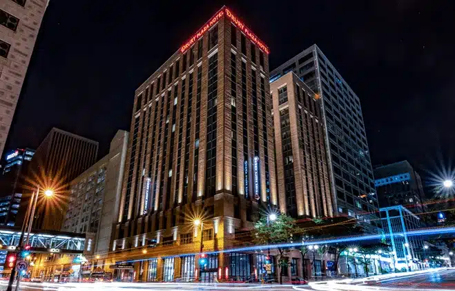 The Drury Plaza Hotel in downtown Milwaukee illuminated at night by street lights