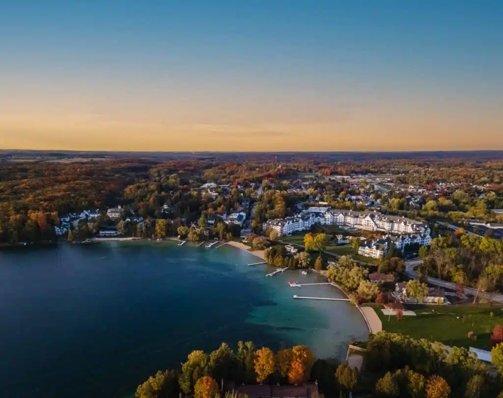 An aerial view of the shoreline Elkhart Lake with manors and large houses