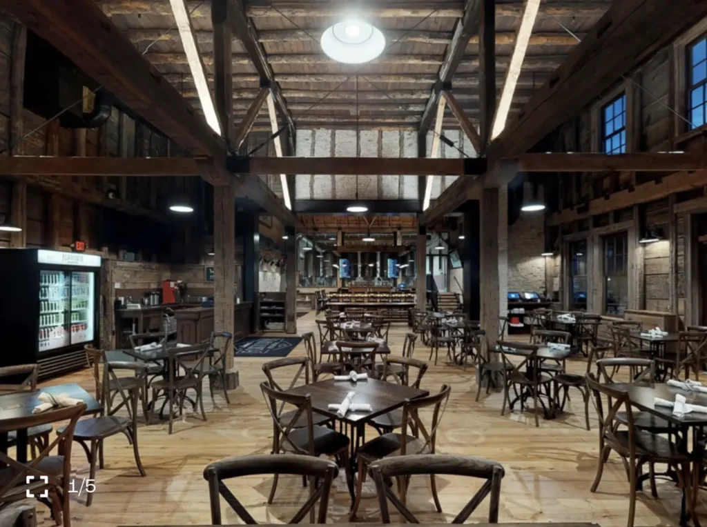 Tables and chairs in a spacious barn style setting at Foxtown Brewing in Mequon