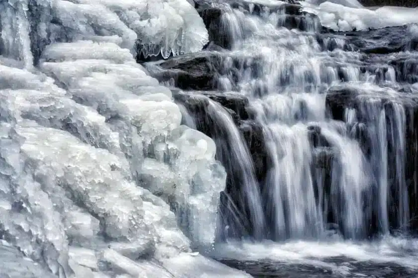 Layered falls with slightly frozen water at Sauk Creek Nature Preserve in Port Washington