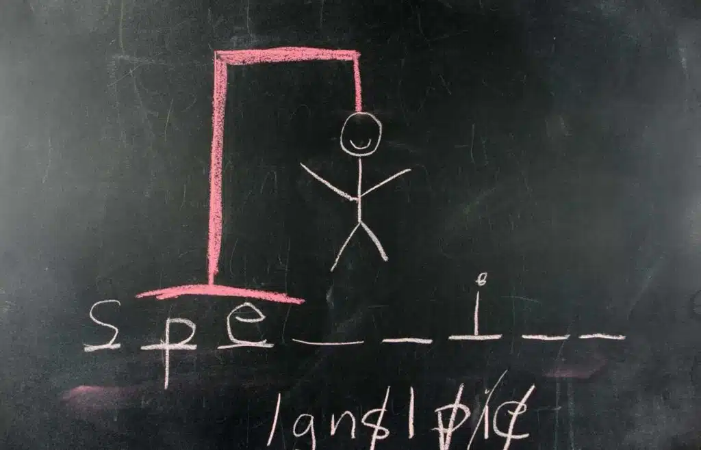 Hangman word game drawn on a chalkboard