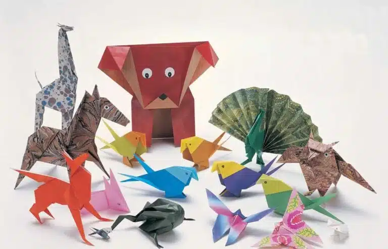 Colorful origami animals arranged on a white background
