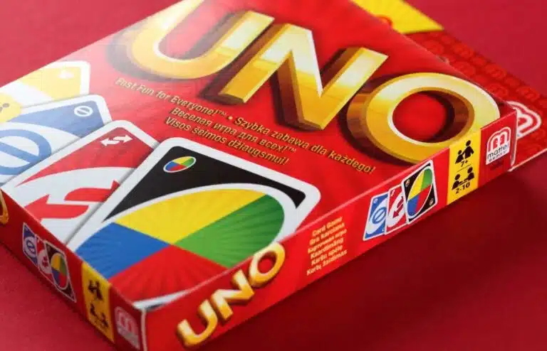 Uno card game box on a red surface