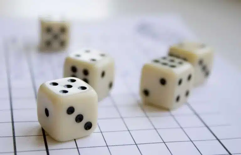 Dice arranged on a score sheet for Yahtzee