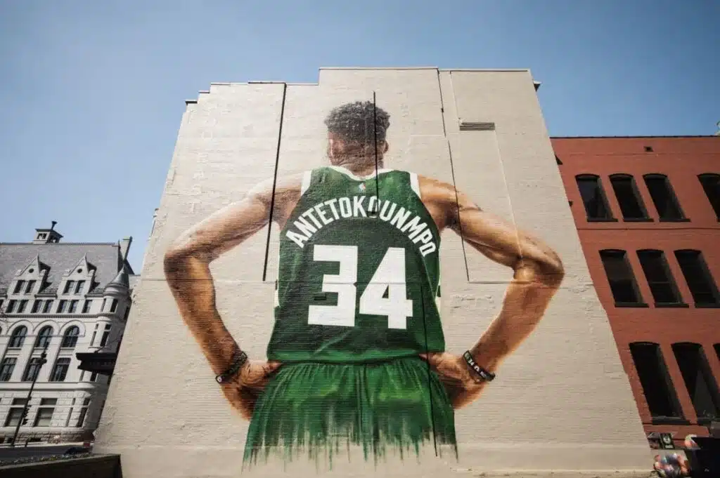 Large Giannis Antetokounmpo mural in downtown Milwaukee celebrating the Milwaukee Bucks and local sports culture.
