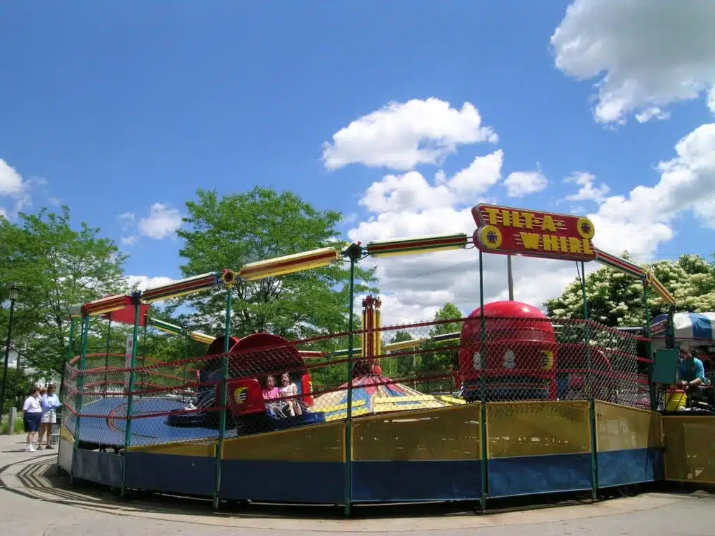 A Tilt-a_Whirl ride with red cars Bay Beach Amusement Park in Green Bay Wisconsin