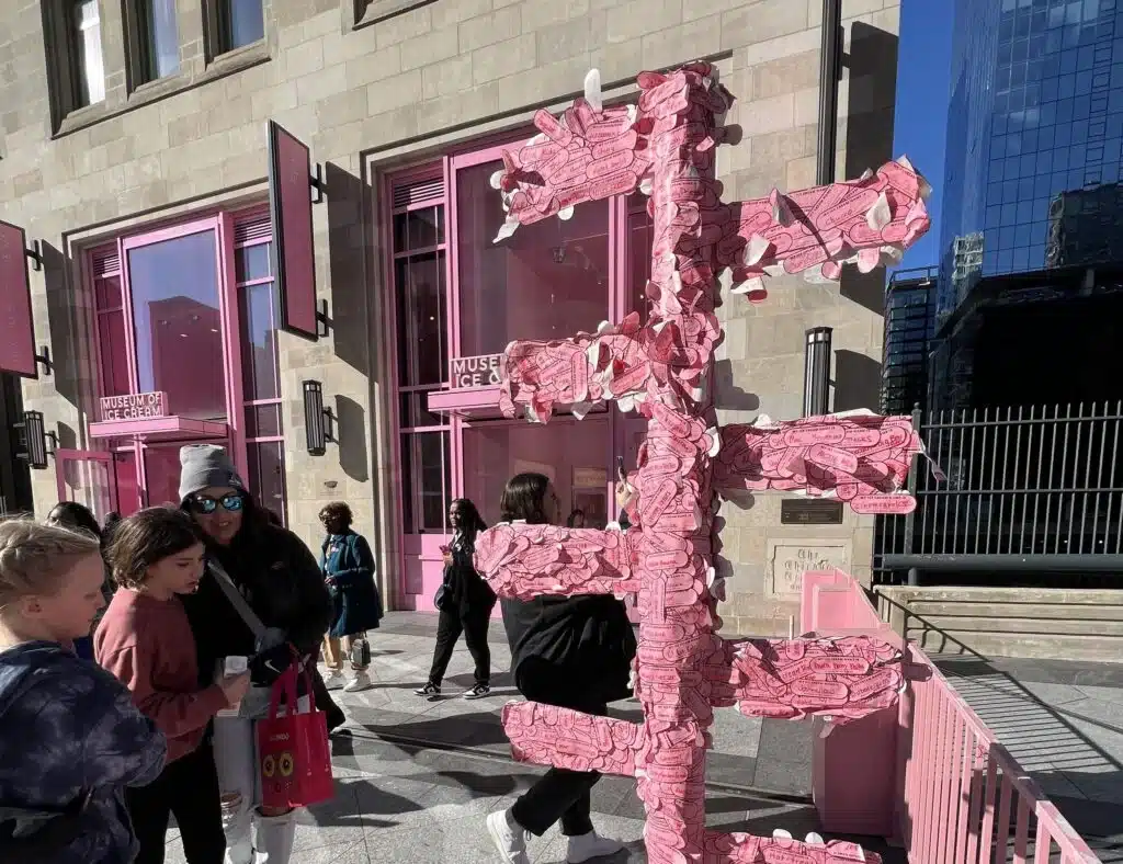 Visitors gather outside the pink Museum of Ice Cream entrance in downtown Chicago.