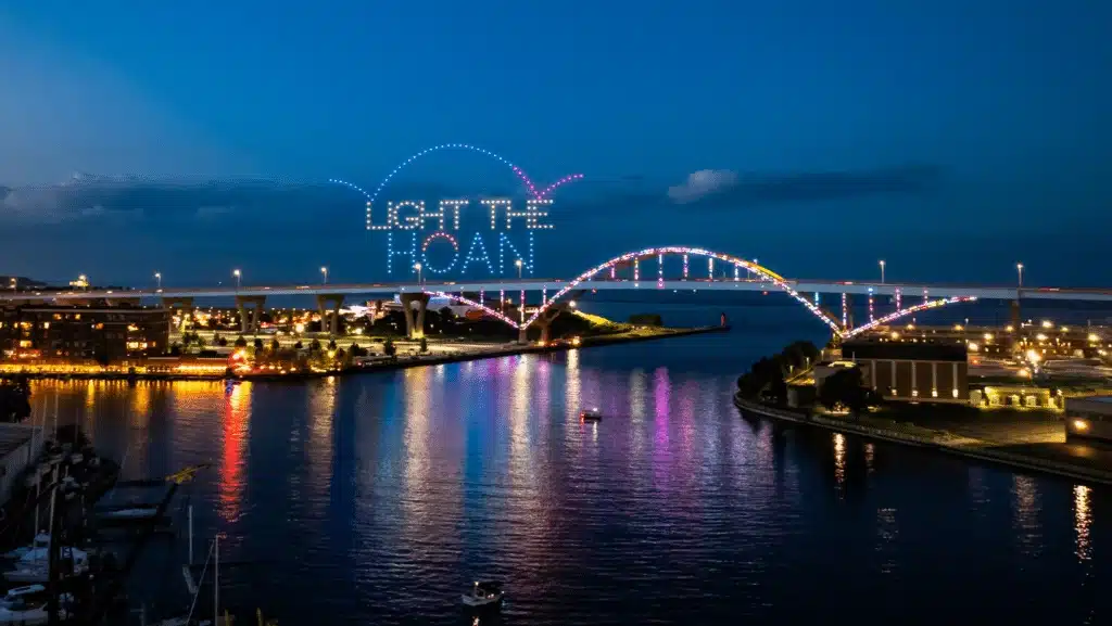 Hoan Bridge brightly illuminated during the annual Hoan for the Holidays display with the surrounding buildings brightly shining
