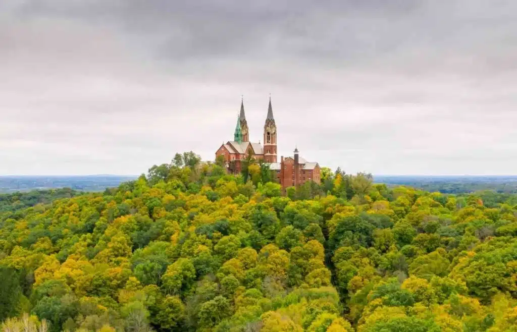 Spires of Holy Hill Basilica in Hubertus Wisconsin surrounded by lush trees