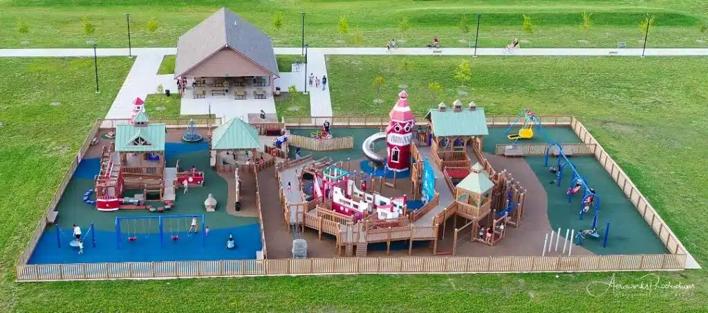 Aerial view of Dream Playground in Kenosha with colorful castle-style play structures.
