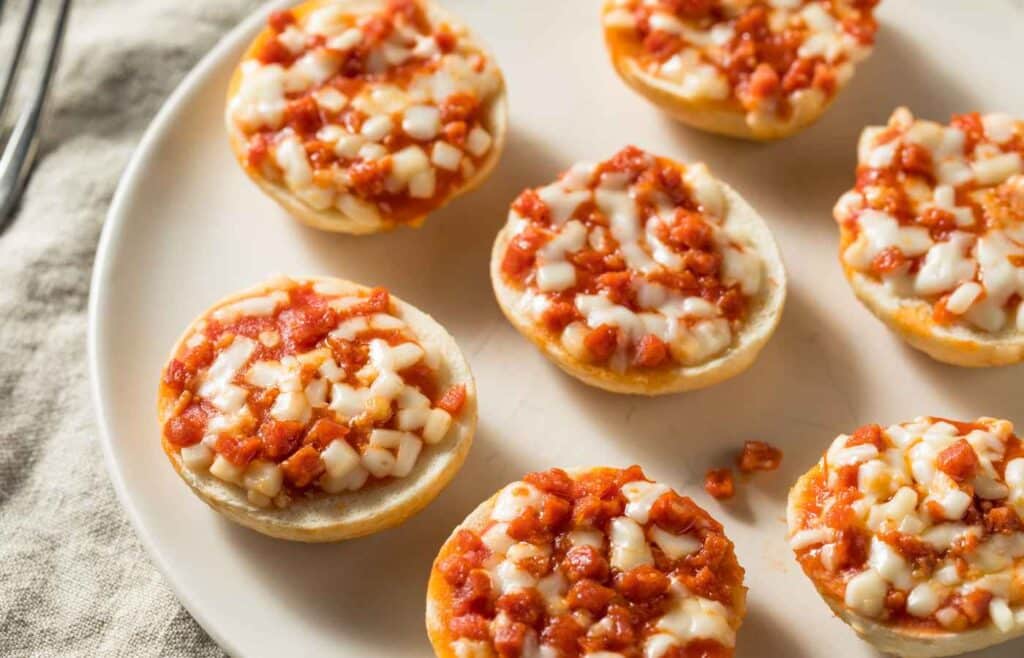 Mini pizzas placed on a large white plate for a fun-filled birthday celebration
