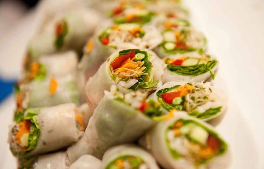 Bite-size cuts of vegetable rolls made of cabbage, tomatoes, cucumber and cheese