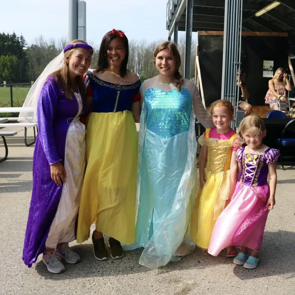 Kids and staff dressed as princesses during a themed game night.