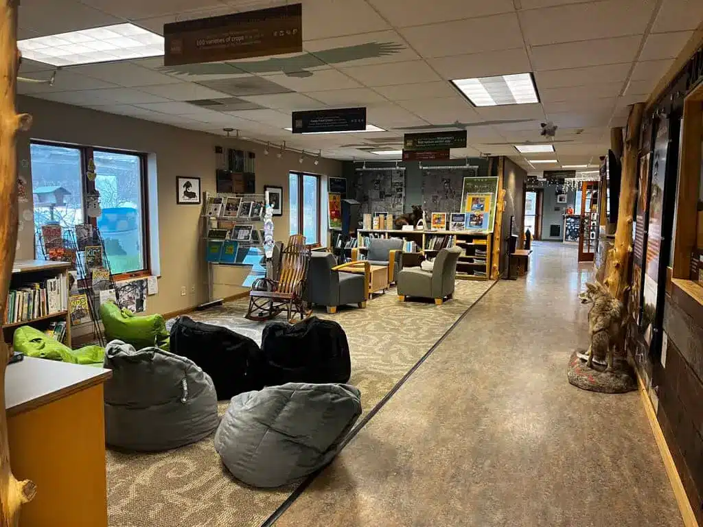 Interior of the Pieper Power Education Center with floor pillows. chairts and magazines