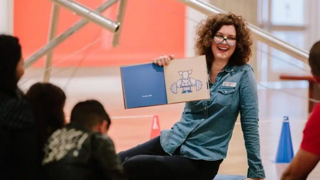 Museum educator leading a children’s activity at the Milwaukee Art Museum.