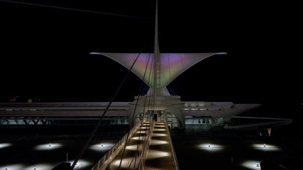 The Milwaukee Art Museum as viewed from the bridge with the wings glowing in soft gradient colors