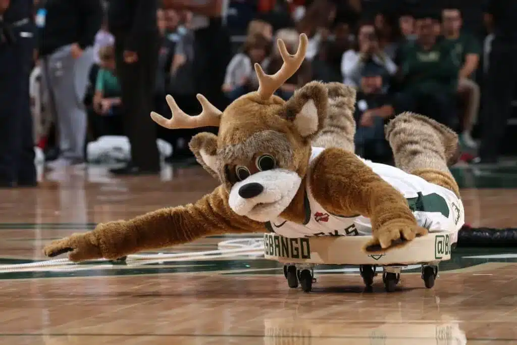 Milwaukee Bucks mascot Bango entertaining families during a home basketball game.
