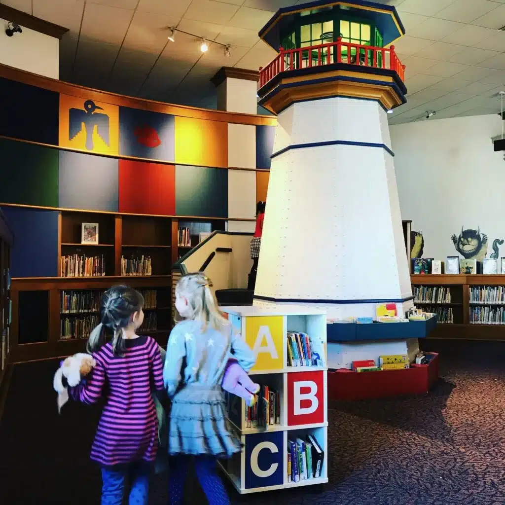 Children exploring lighthouse exhibit inside Milwaukee Central Library