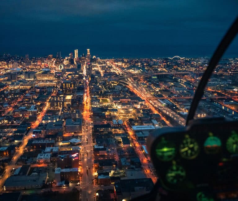 View of evening Milwaukee skyline while riding a helicopter