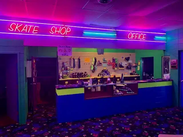 The Skateland counter with neons signs saying skate shop office