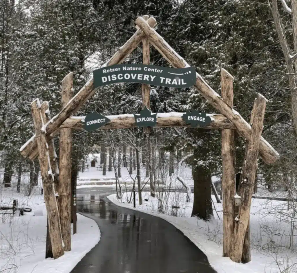 Snowy entrance to the Discovery Trail at Retzer Nature Center in winter.