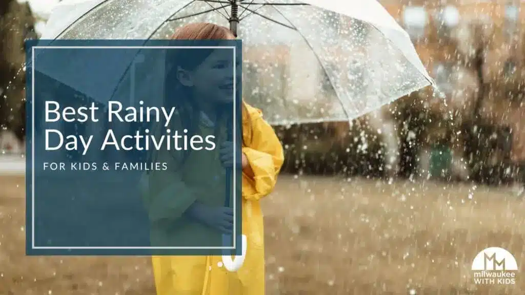 Child in yellow raincoat smiling under clear umbrella during rainfall.