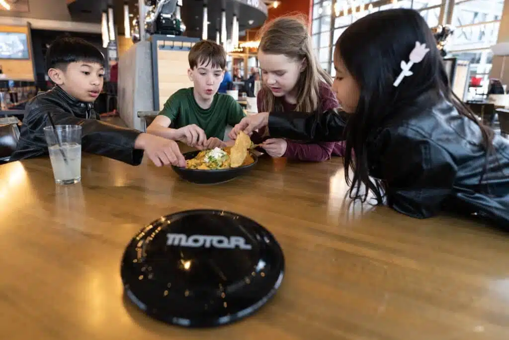 Kids sharing a meal at Motor Restaurant in Milwaukee