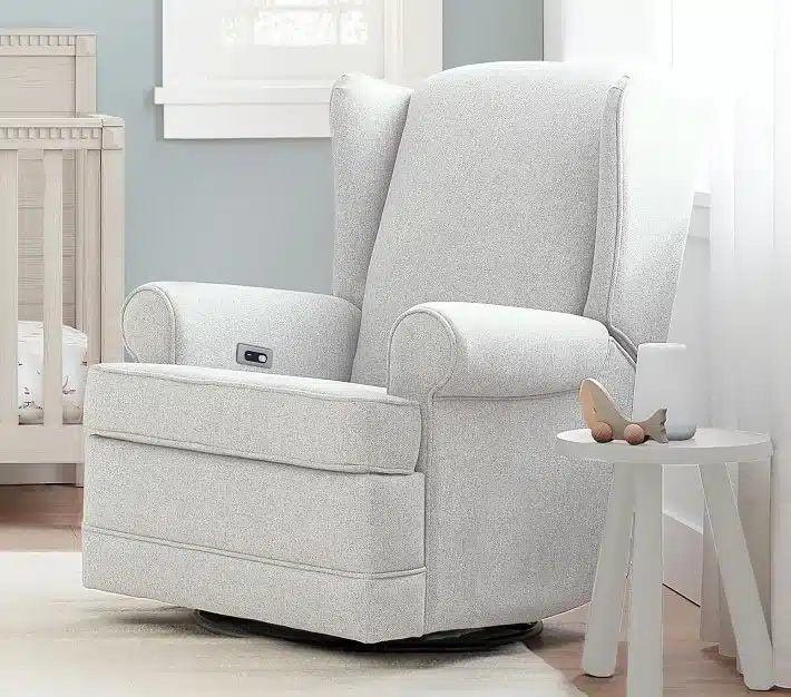 Wingback manual glider recliner with, white curtains and stool